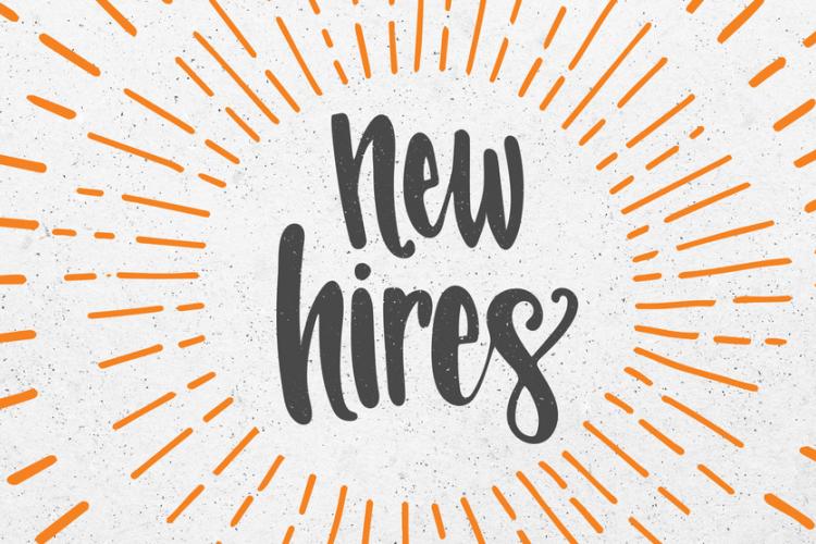 Text "new hires" in black against a light background with sun rays surrounding the text